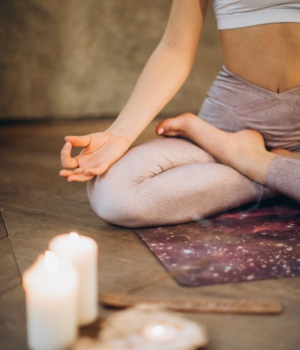 Woman in a calm yoga pose, embodying balance and tranquility.